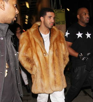 Drake branded 'cheap and ignorant' for wearing fur coat