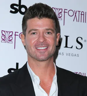 Robin Thicke adopts puppy with girlfriend | Young Hollywood