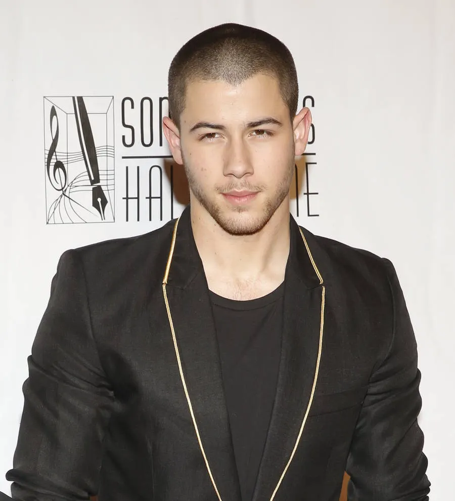 Nick Jonas takes style tips from Elvis Costello | Young Hollywood